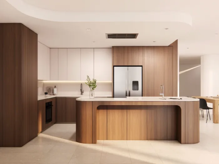 Arredo cucina con isola in legno scuro, top chiaro e isola con testata arrotondata